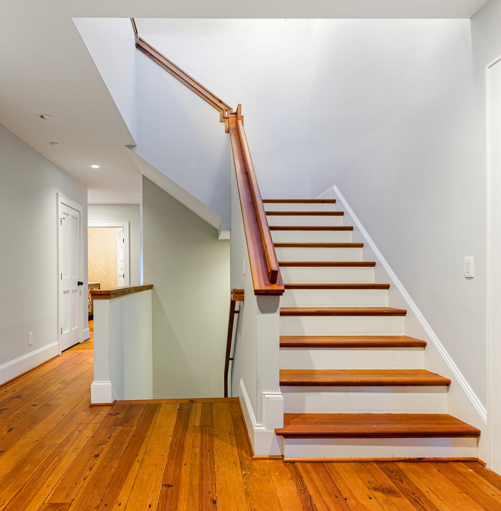 The center stairwell — three levels of heart pine