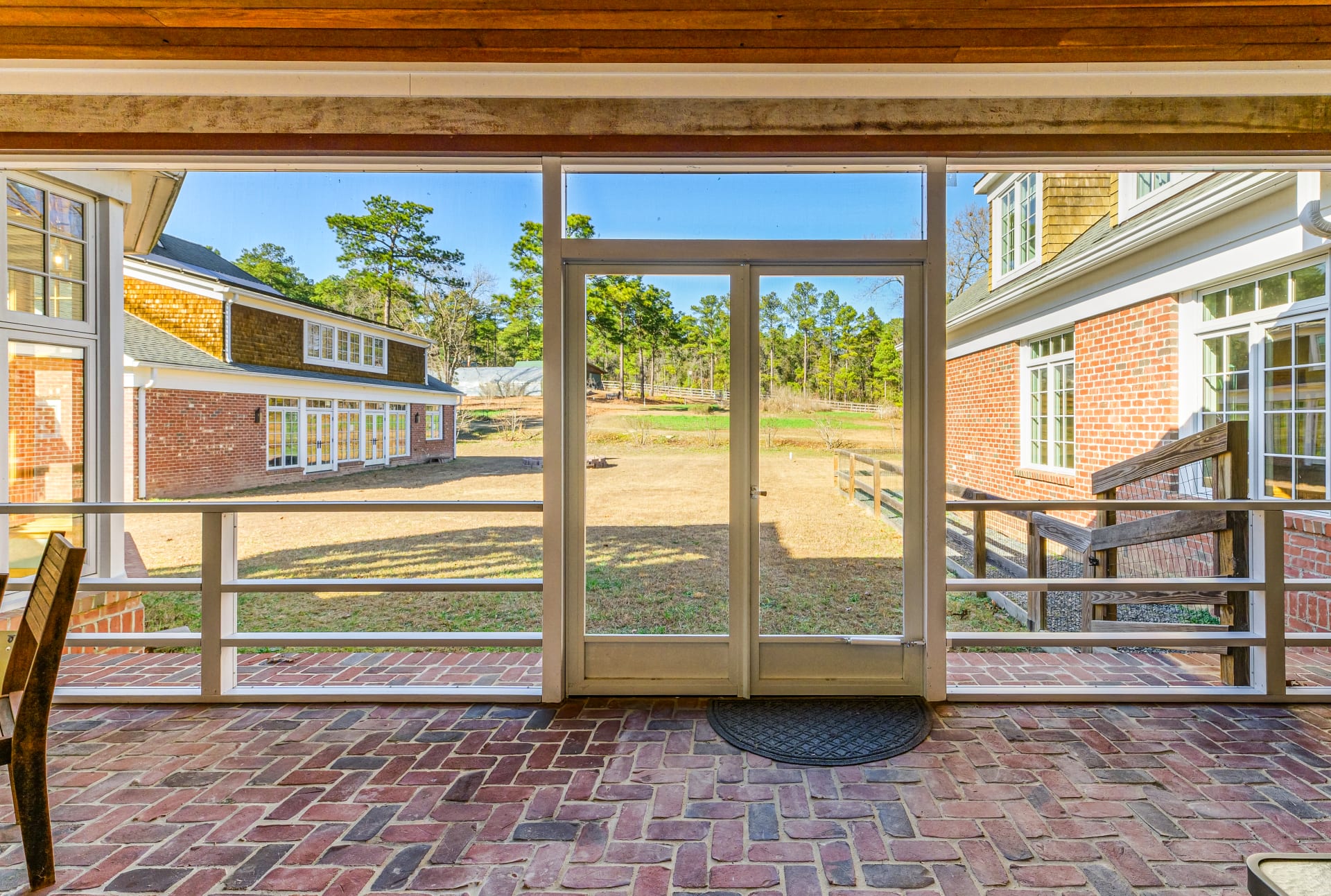 From the screened porch — courtyard and conservatory