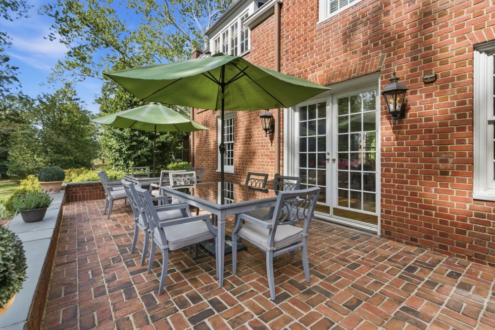 The brick terrace beyond the French doors
