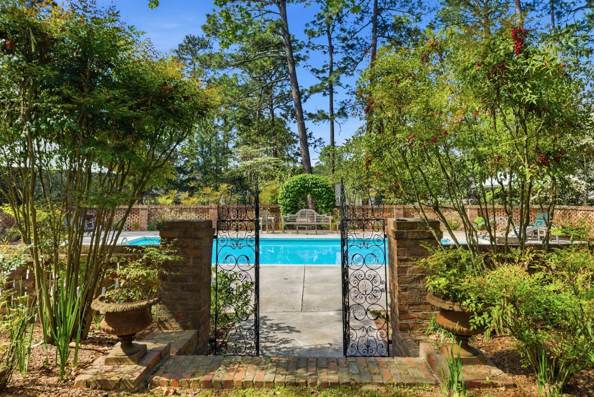 The saltwater pool set within a brick walled garden