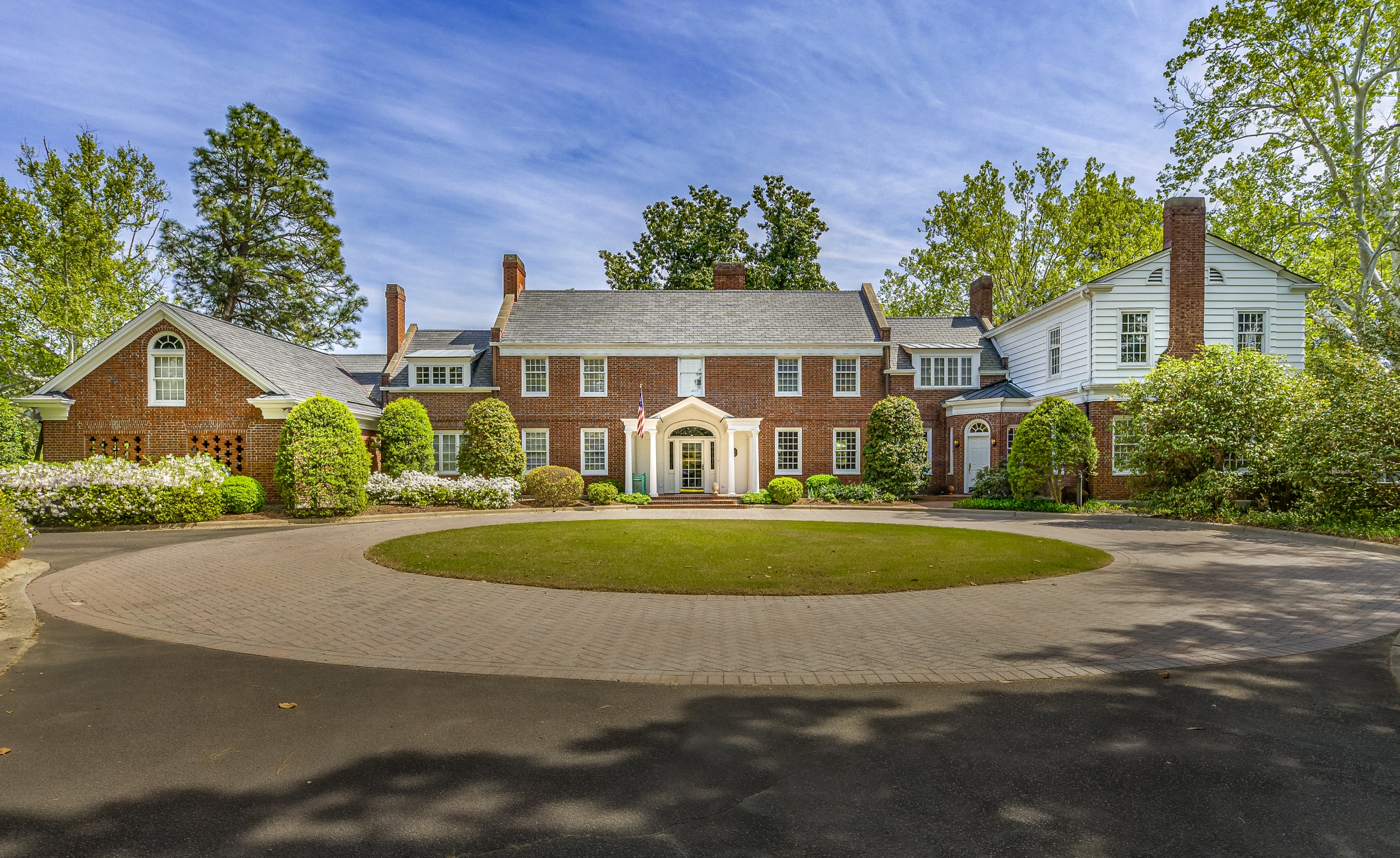 Garran Hill facade, rare handmade red brick laid in Flemish bond above a classic water table