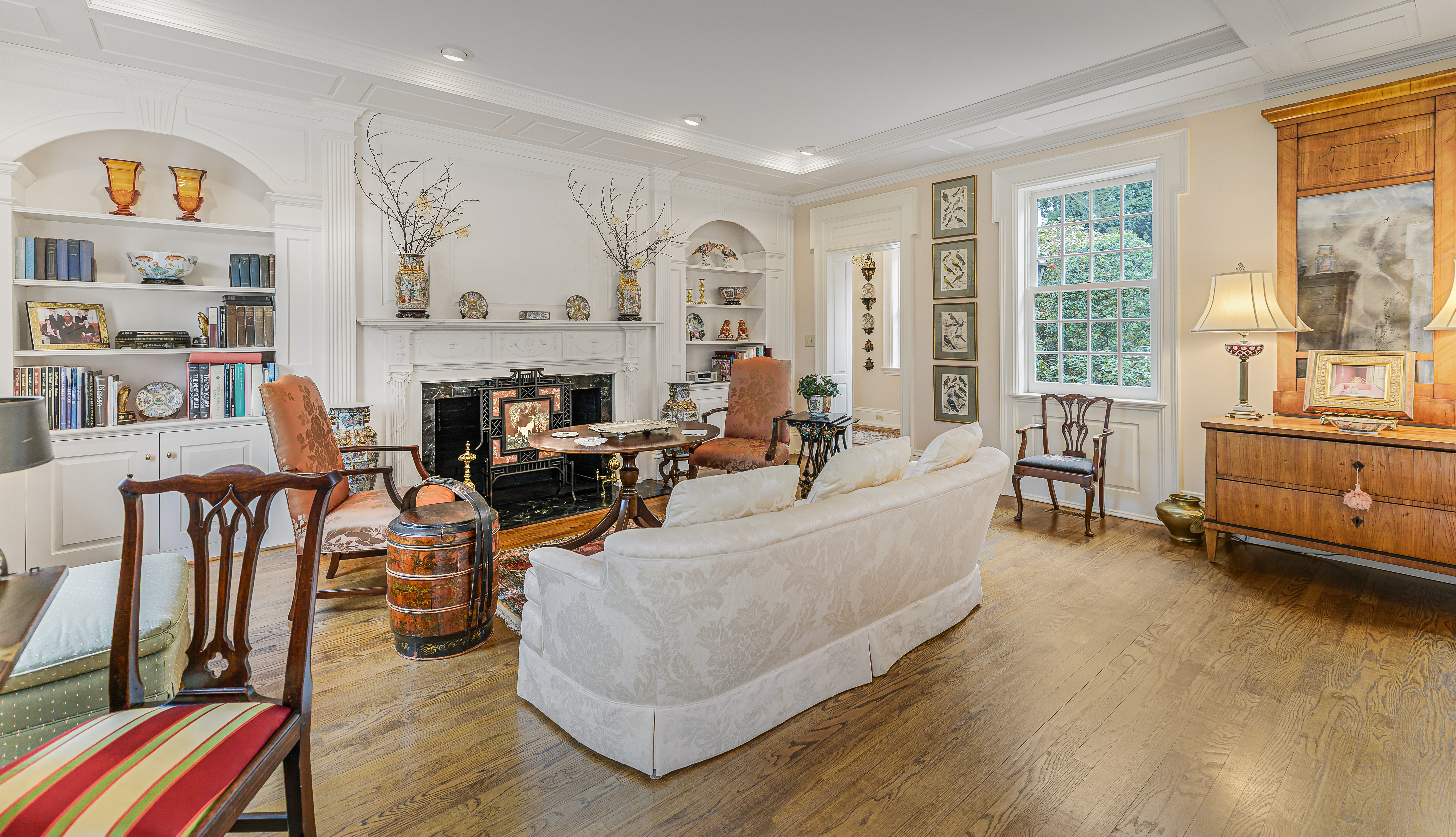 Garran Hill Sitting Room — Delft-tiled fireplace, carved Georgian mantel, spiral staircase