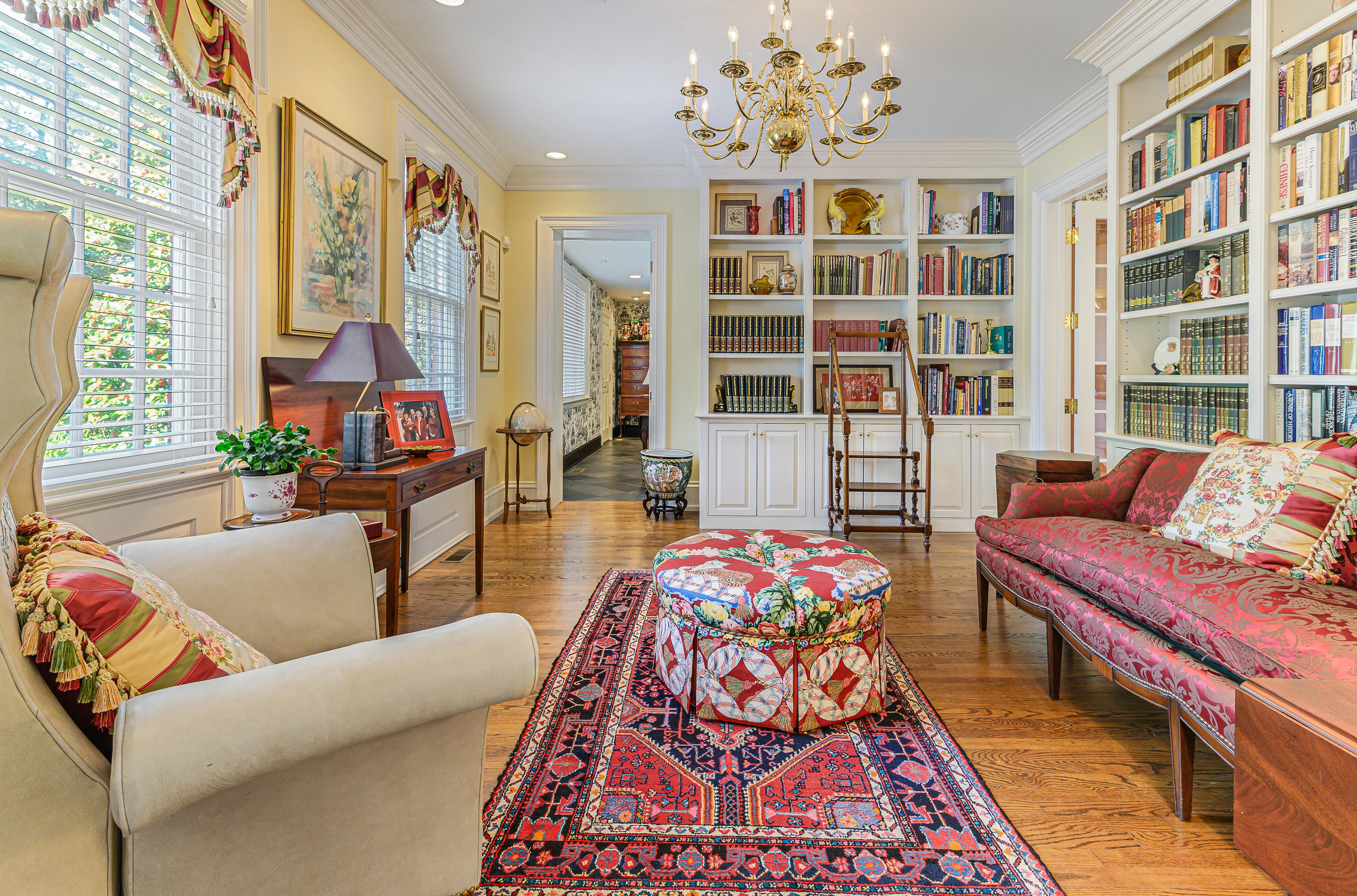 Garran Hill library — floor-to-ceiling shelving, rolling ladder, French doors