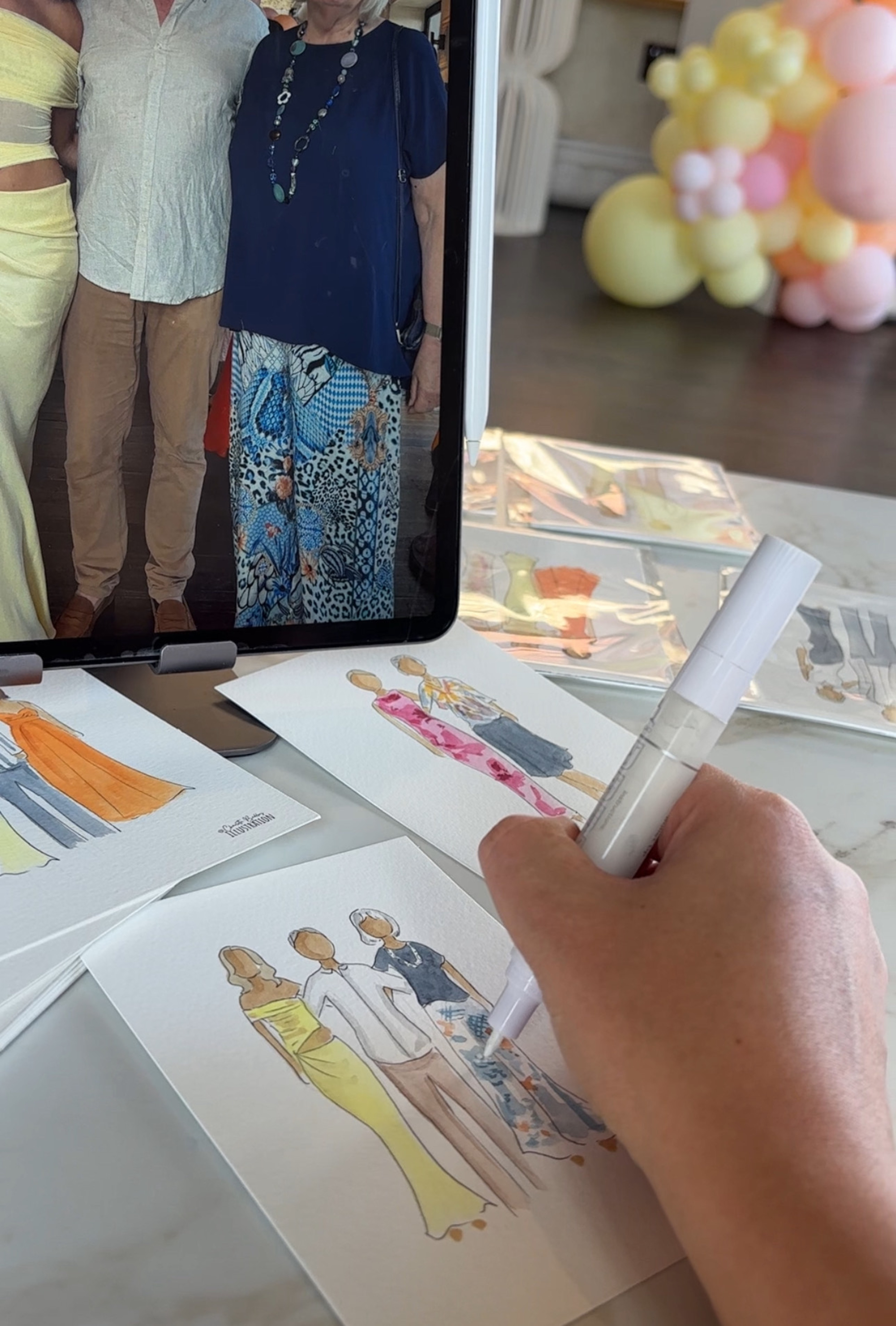 Artist hand-paints fashion-style portraits of wedding guests from a tablet photo on watercolor cards.