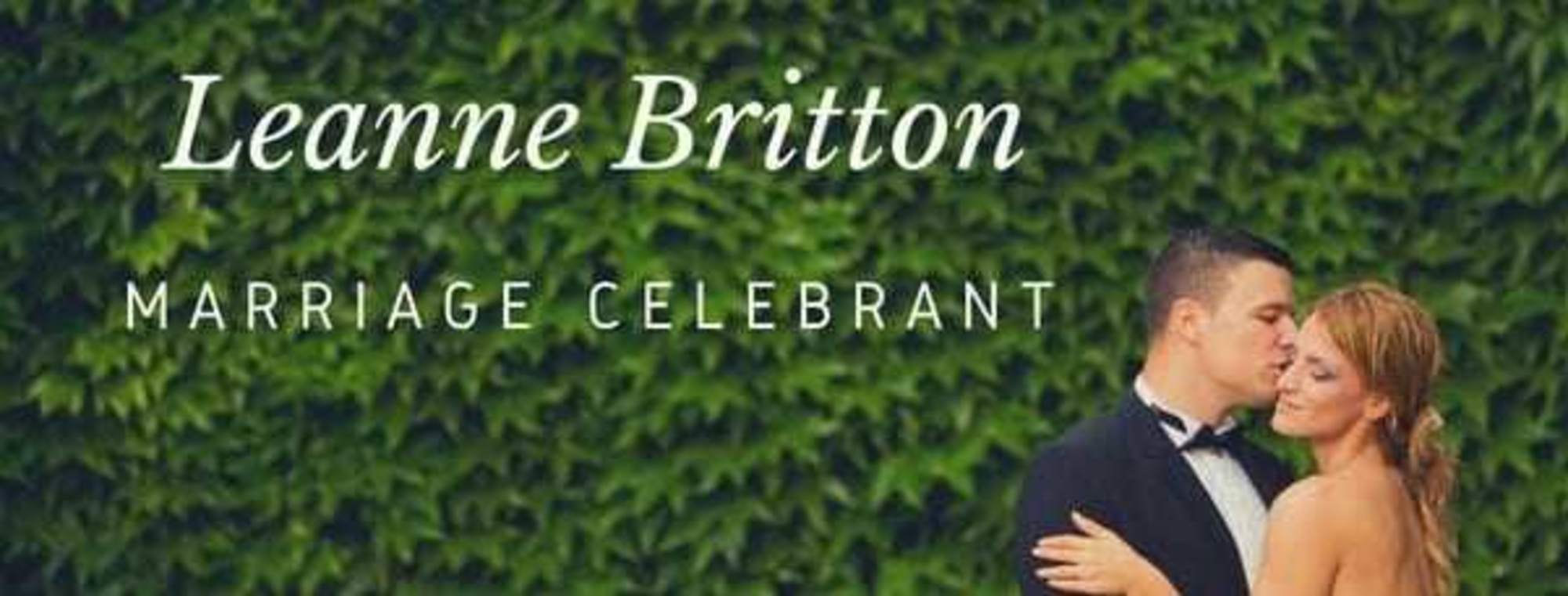 Wedding celebrant banner featuring a couple embracing before a lush green ivy wall.