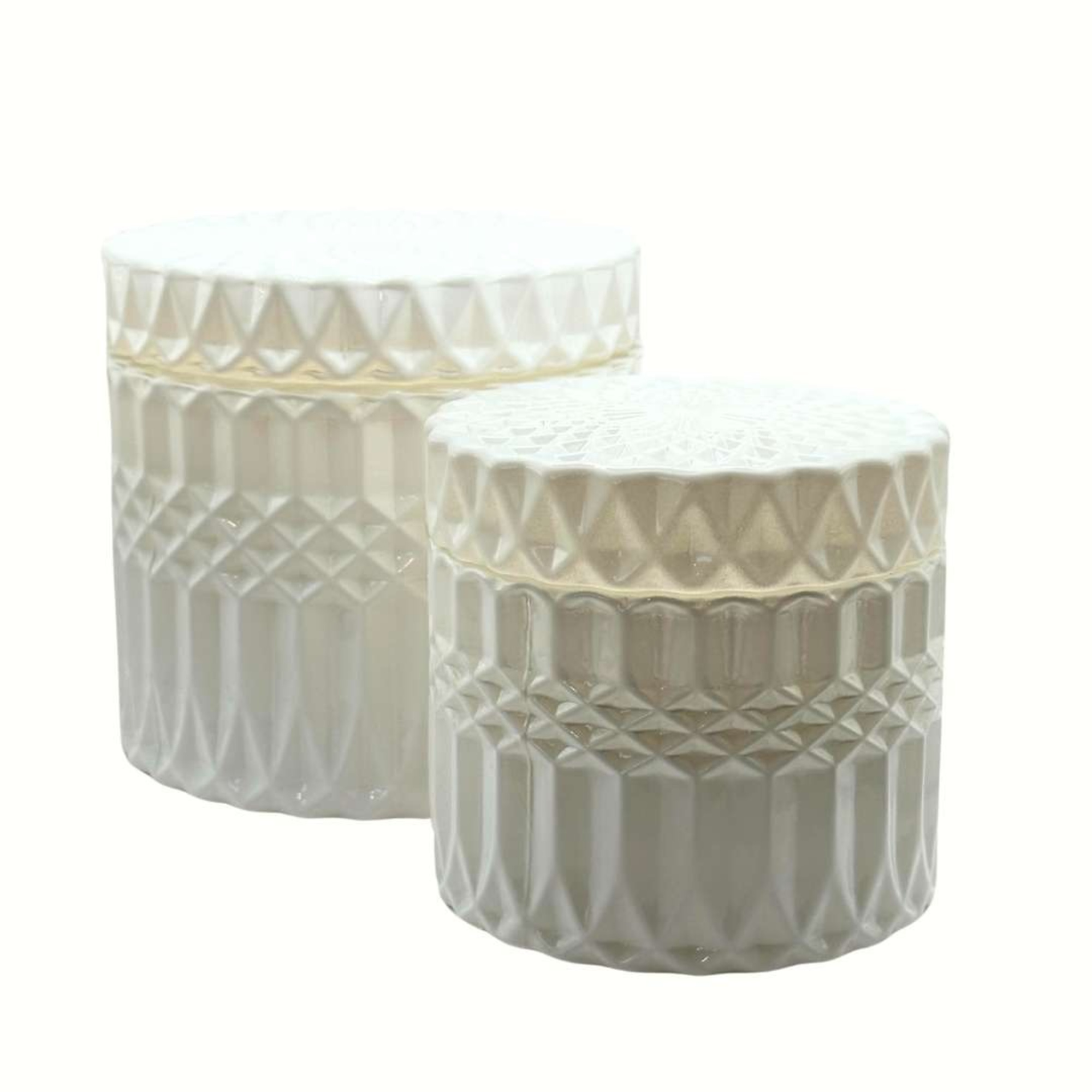 Two white textured ceramic jars with lids used as elegant wedding decor accents.