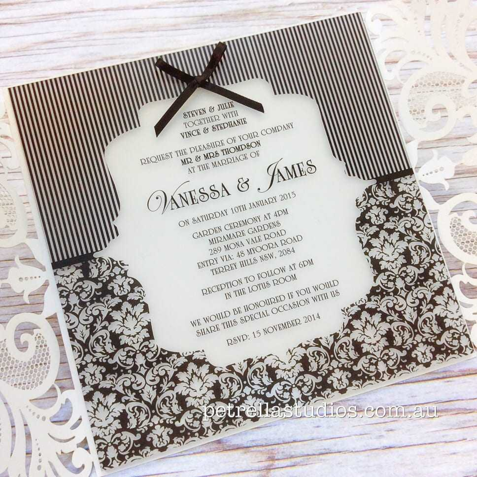Elegant black and white wedding invitation card with striped and damask patterns and decorative script text.