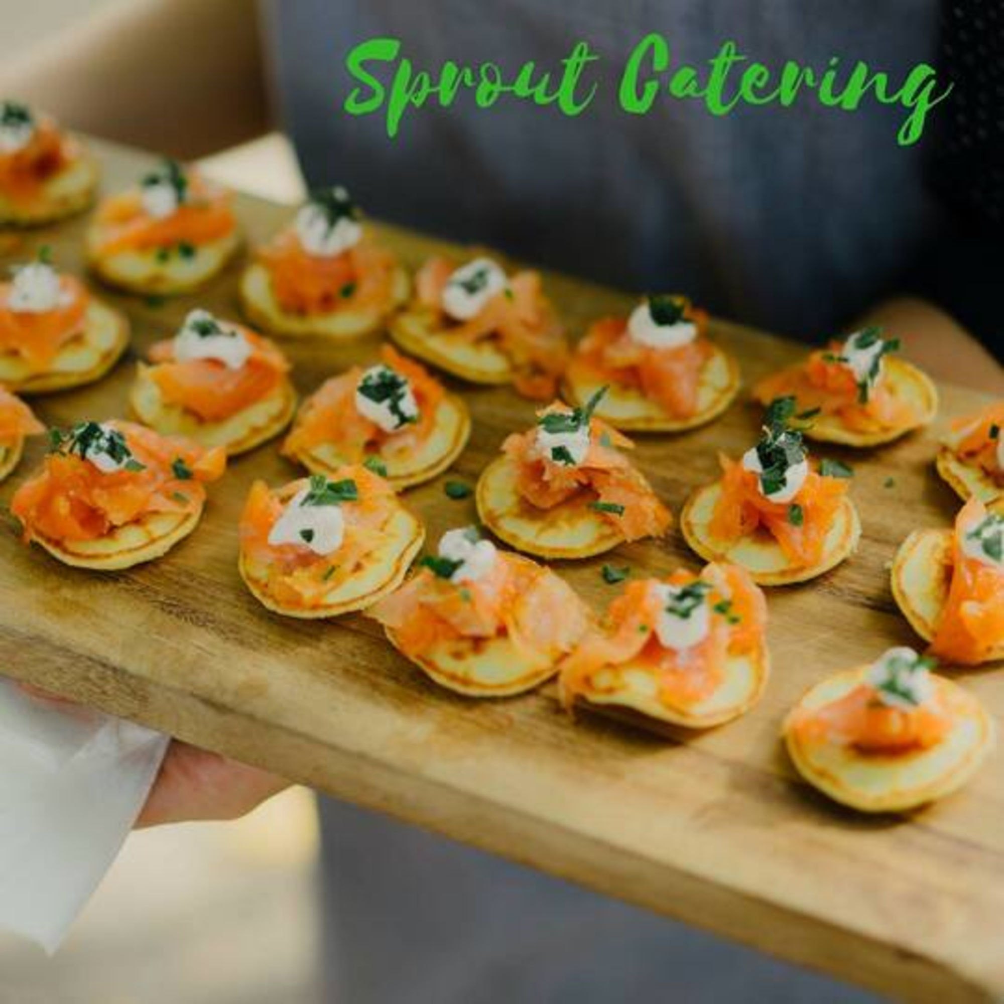 Tray of bite-sized salmon canapés served by Sprout Catering at a wedding event.