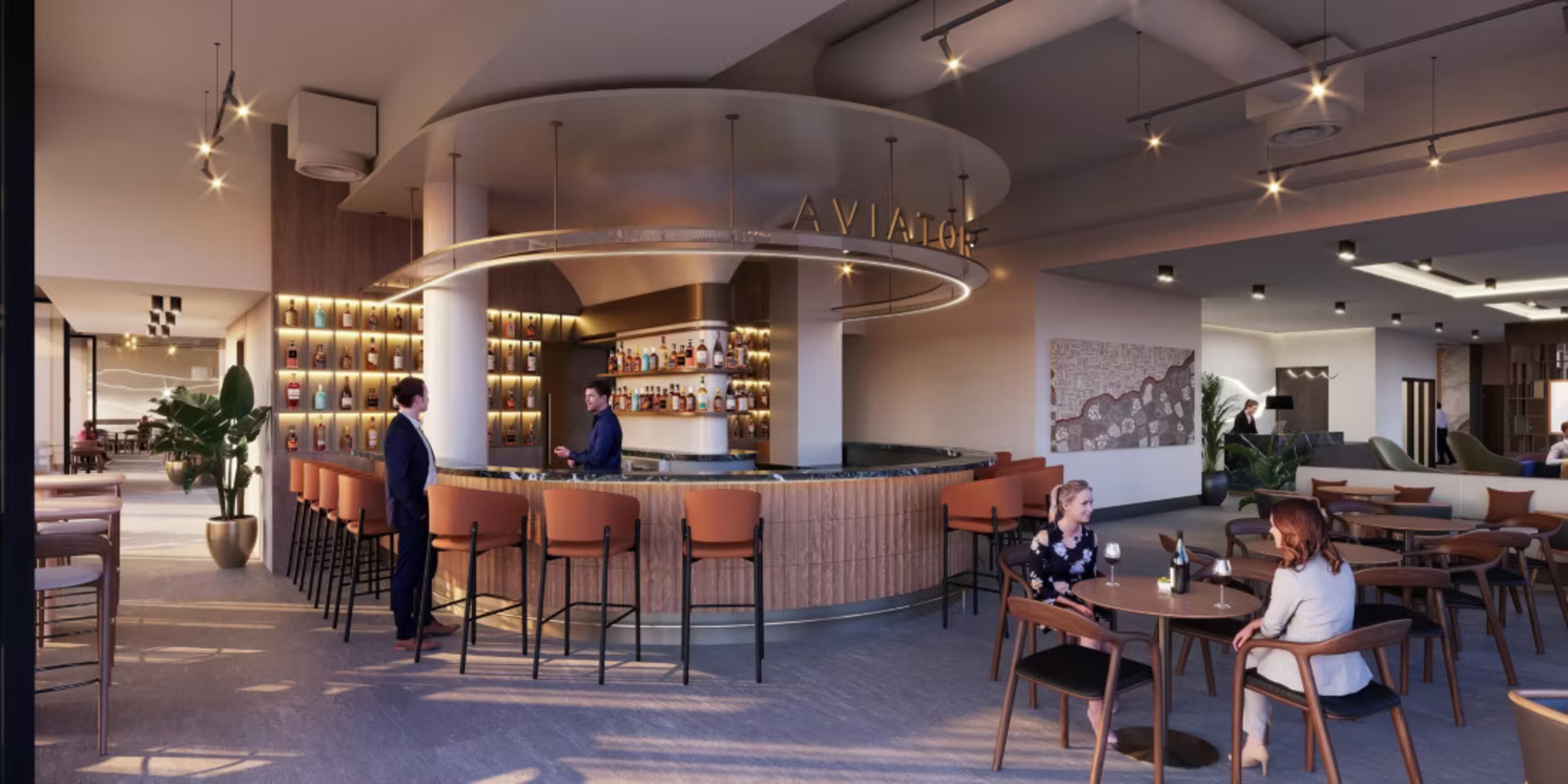 Modern hotel bar and lounge with guests enjoying drinks in a warm, stylish setting.