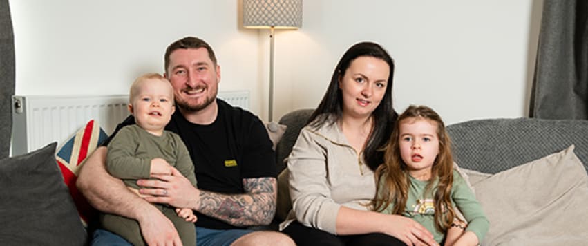 Couple on sofa with boy and girl