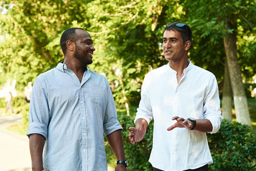 Two men walking in the park