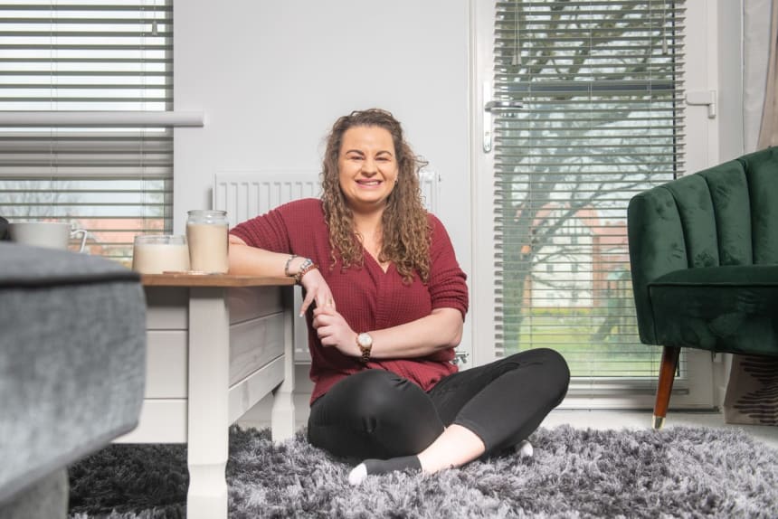 Smiling lady sitting on floor