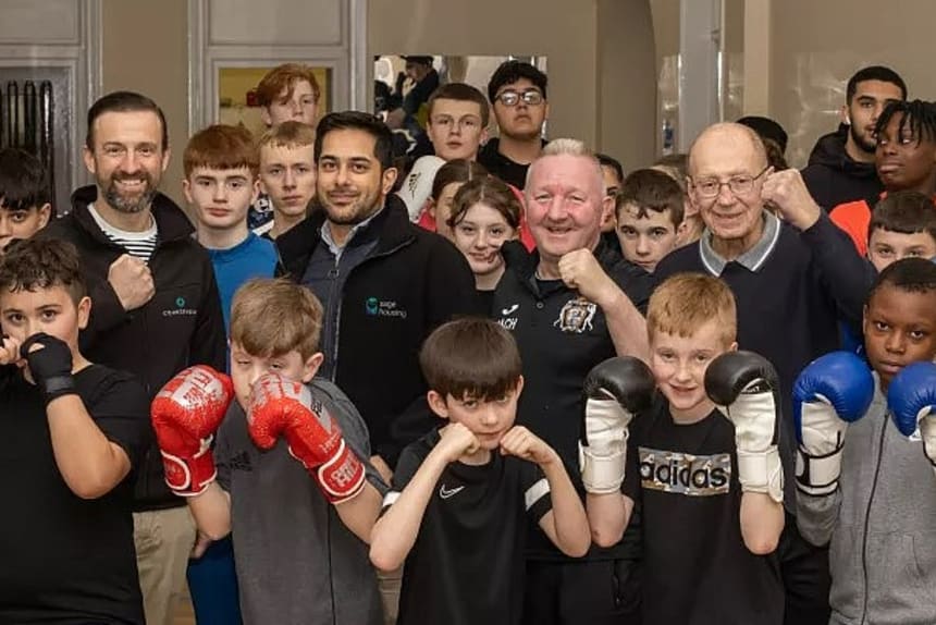 Group of residents of mixed age at boxing ring