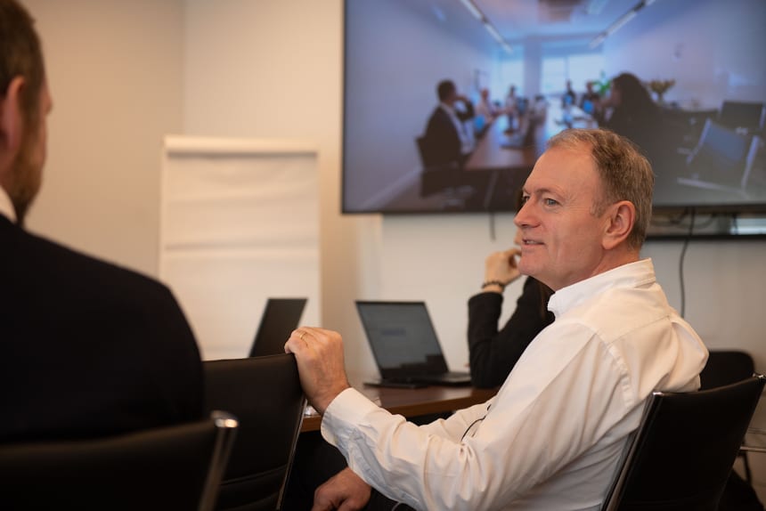 men at meeting table