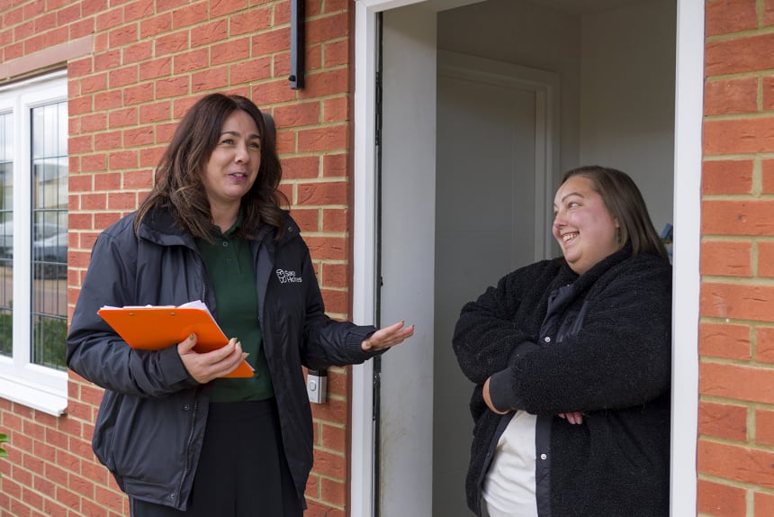 Sage Homes and Communities Officer meets customer at front door for a chat