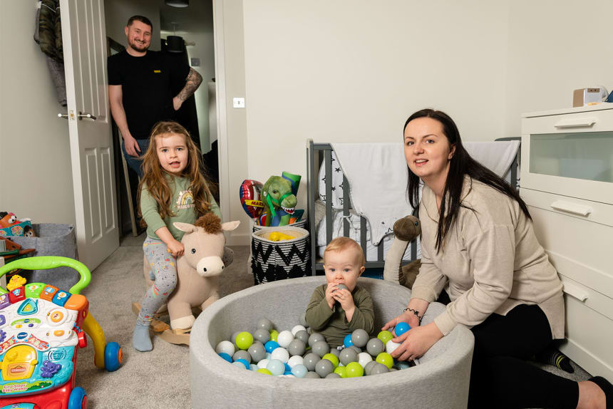 Parents with two children in playroom