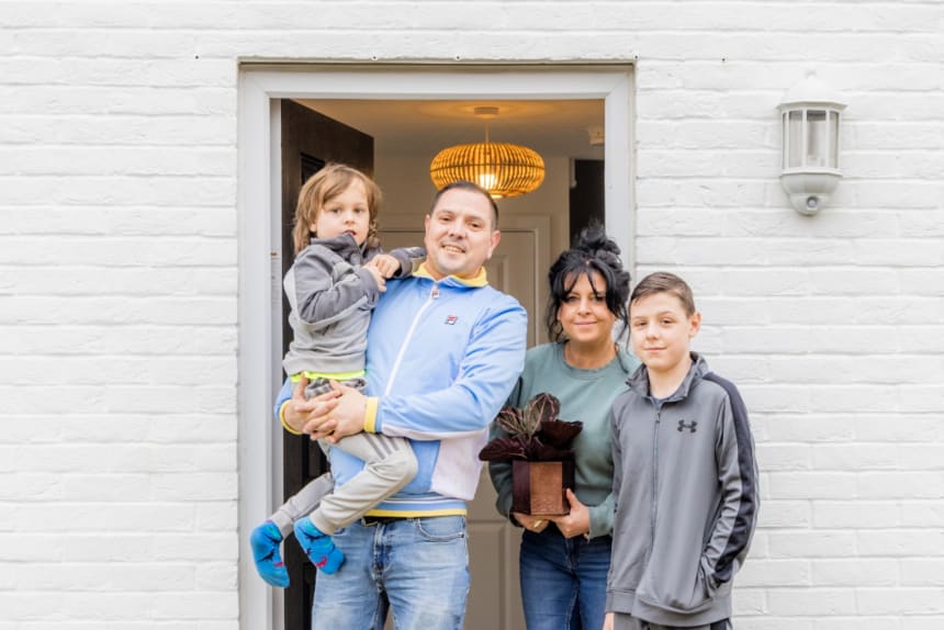 Family standing at front door