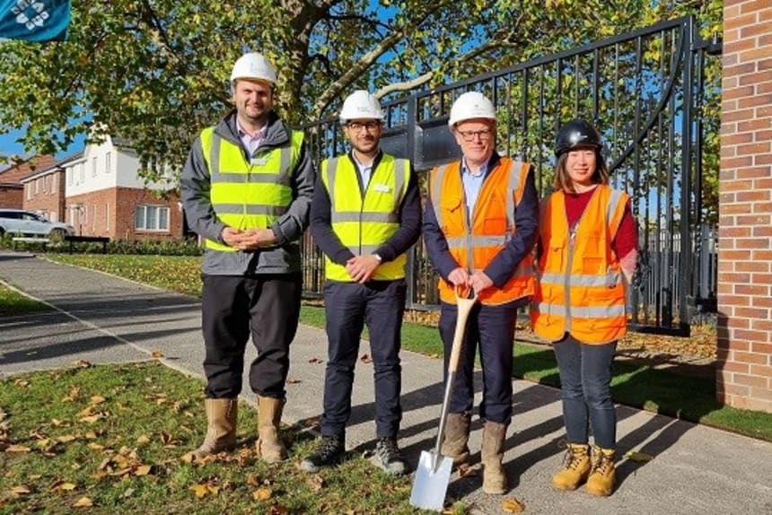 Three men and a women in  high visibilty jackets