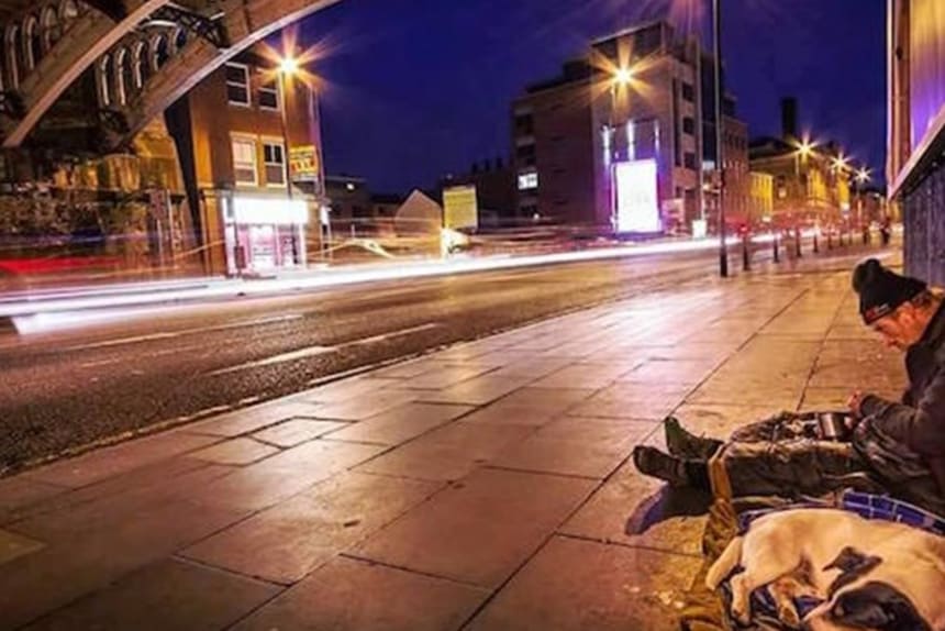 man sleeping under arches