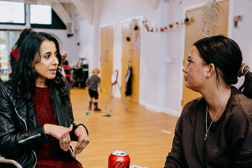 Two ladies talking at an event