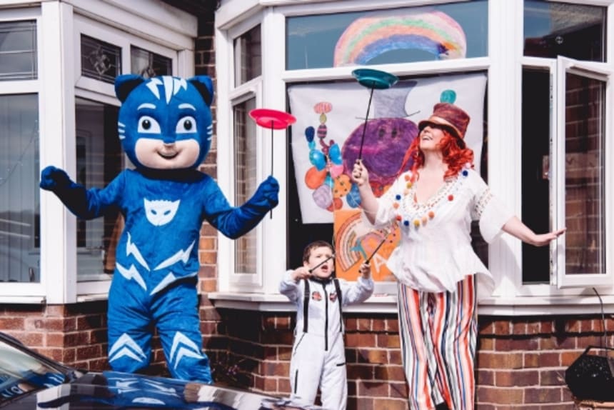 Two adults and a child dressed up and having fun