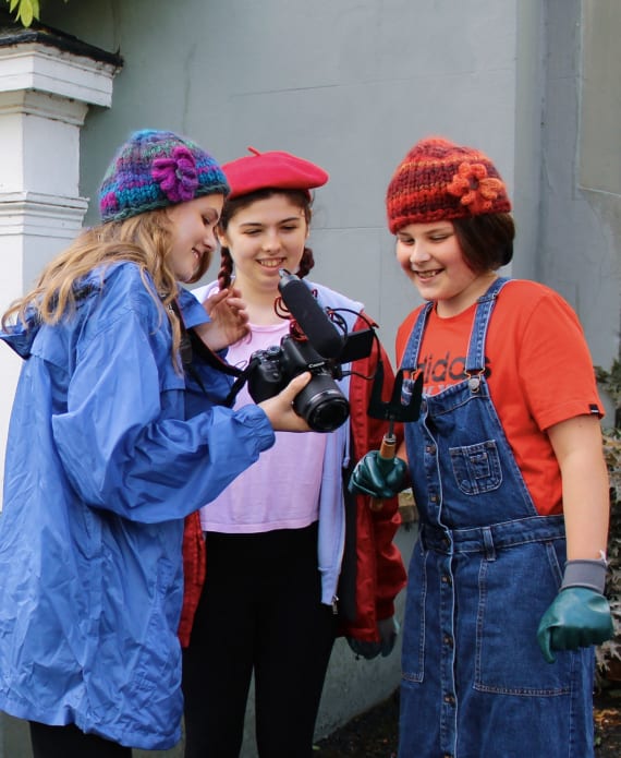 Three women looking at camera