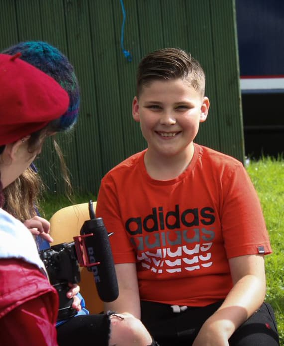 Young smiling boy in red t-shirt