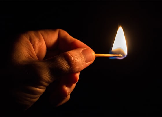 Someone holding a match
