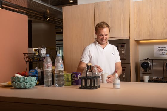 smiling man in kitchen