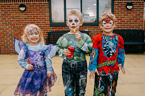 children dressed as fairies and superheroes
