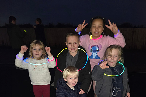 children dancing with hoops