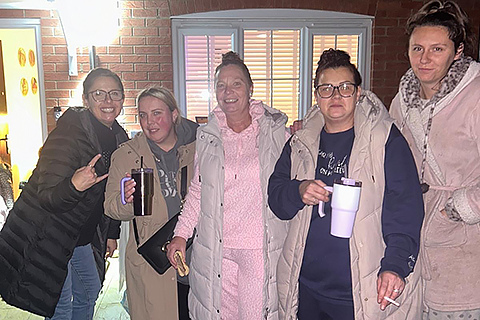 neighbours standing together