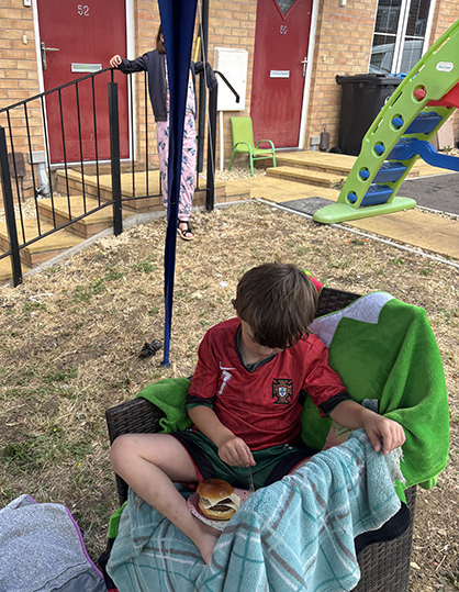 boy eating a hamburger