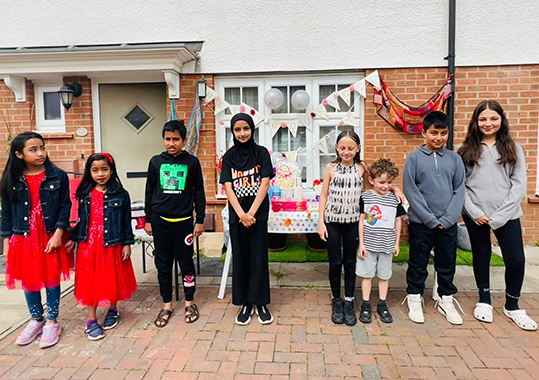 neighbours standing in a group
