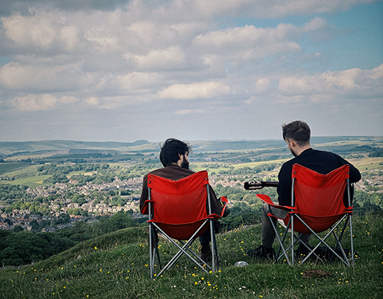 back view of two men looking at view