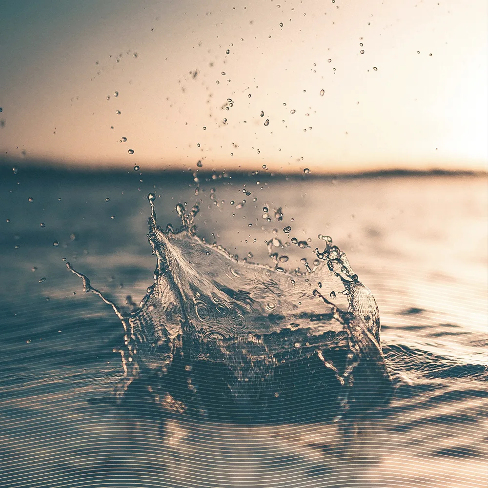 water droplet hitting a pool of water