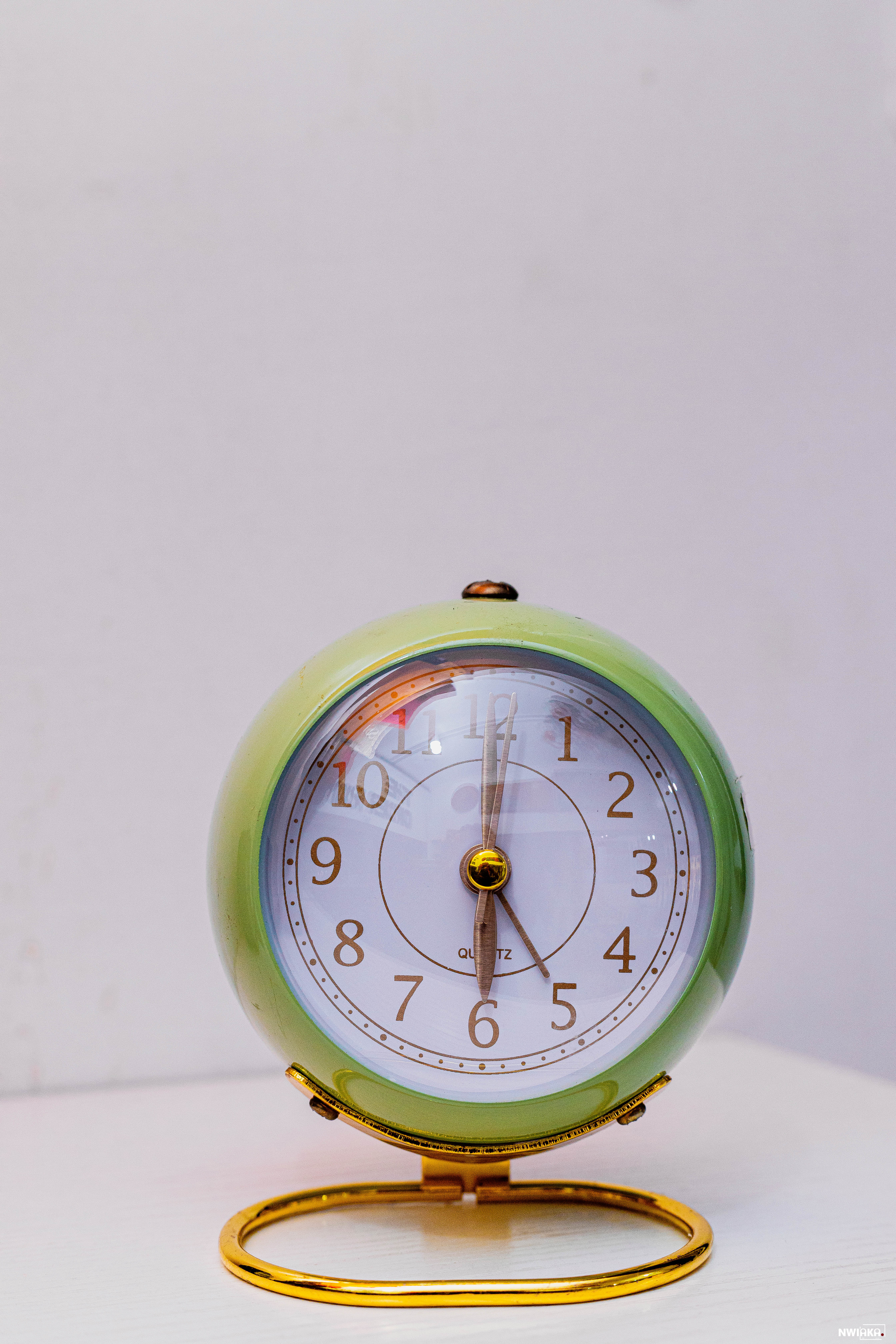 A cute miniature bedside alarm clock