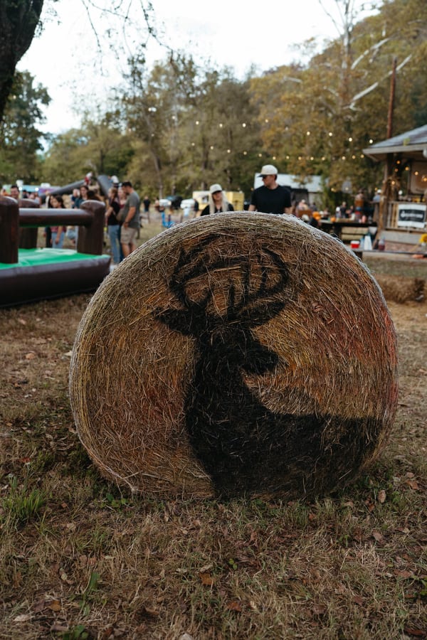 Hay bale painted with a deer silhouette