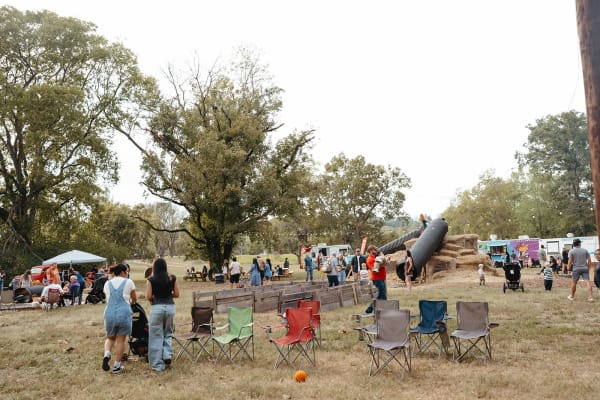 Families with lawn chairs spread across the open field