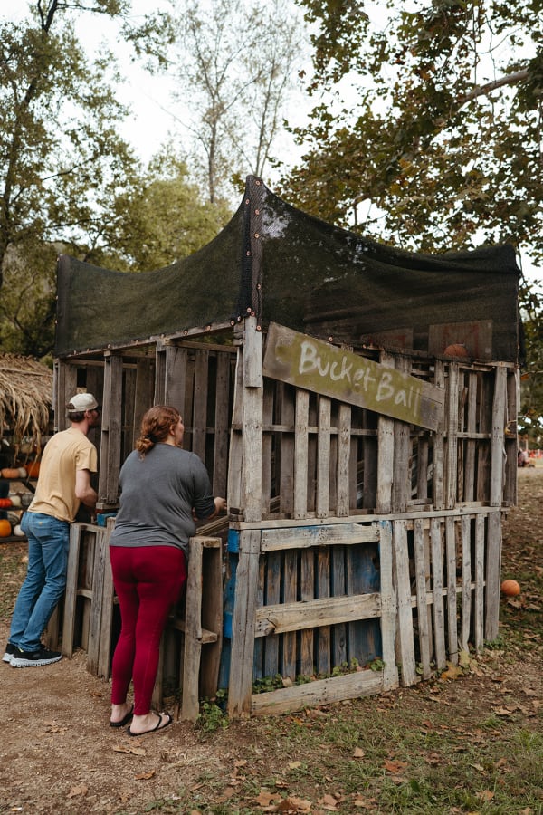 Guests at a rustic wooden pallet booth
