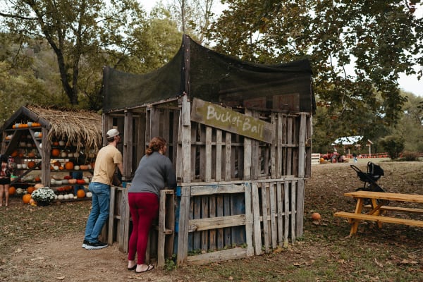Guests at a rustic wooden pallet booth