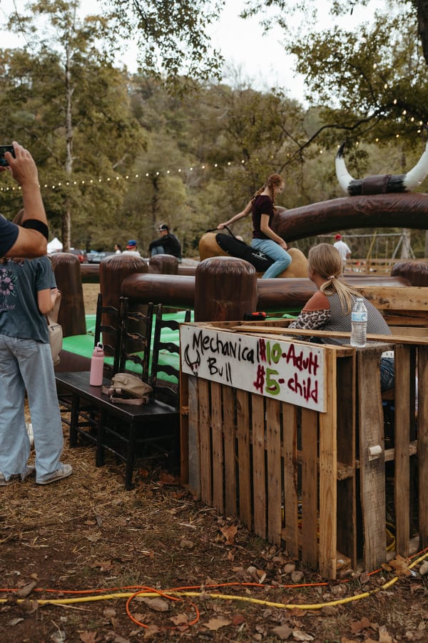 Mechanical bull ride and sign