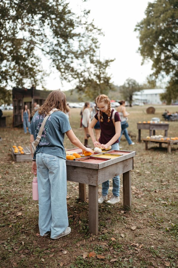Guests playing a game at a wooden table