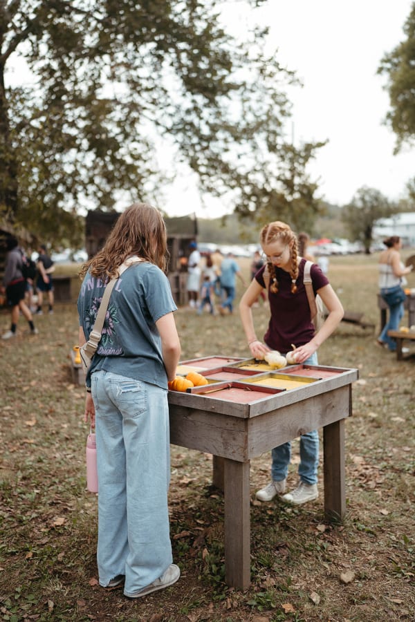 Guests playing a game at a wooden table