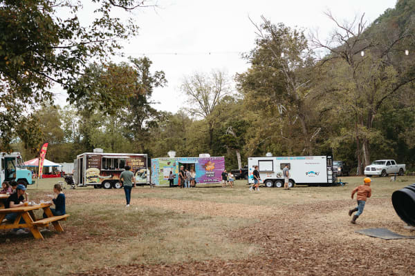 Food trucks lined up across the field