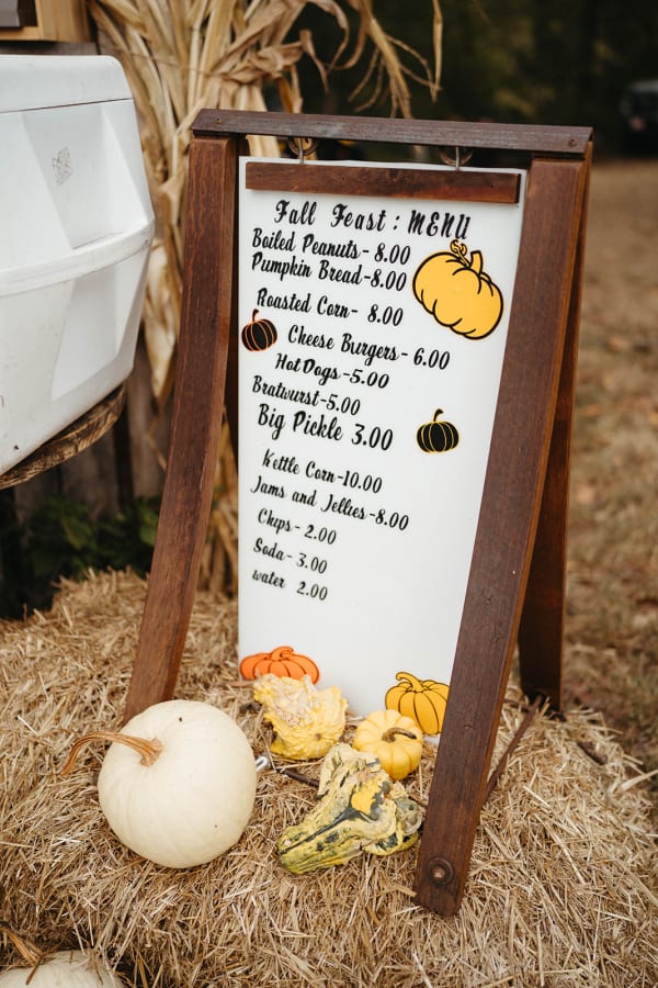 Fall Feast menu board on a hay bale