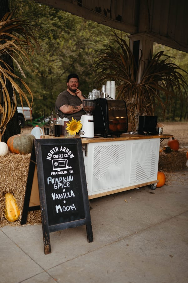 Coffee cart with a pumpkin spice menu chalkboard