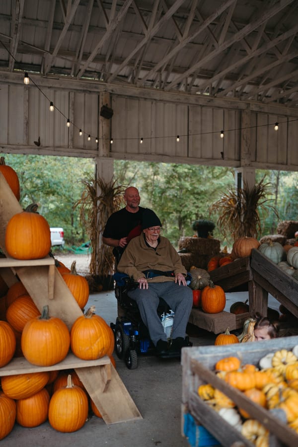 Guests resting beside the pumpkin display