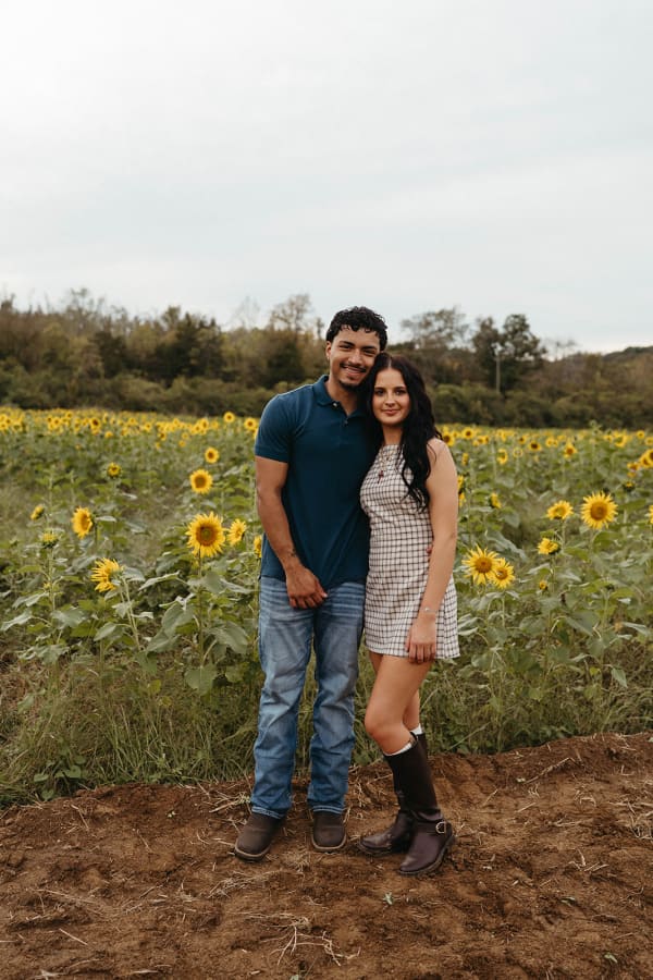 Couple posing in the sunflower field