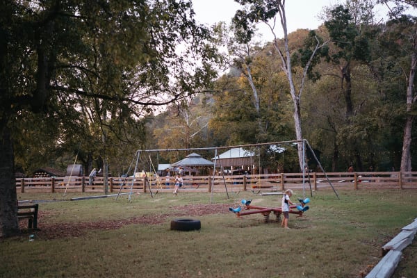 Swings and picnic tables in the play area